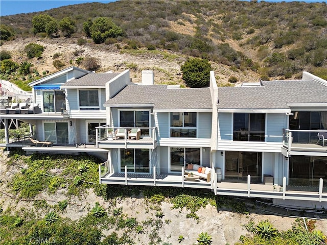 21659 Ocean Vista Dr Unit 20, Laguna Beach, CA 92651 - rear view of property with a mountain view, roof with shingles, and a balcony