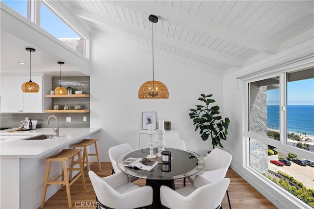 21659 Ocean Vista Dr Unit 20, Laguna Beach, CA 92651 - dining area with light wood finished floors, plenty of natural light, a water view, and wooden ceiling