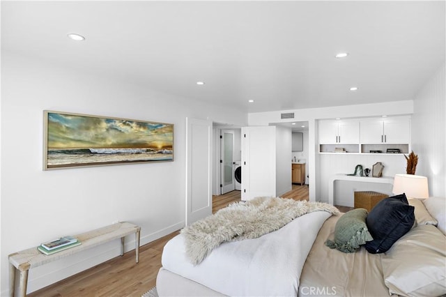 21659 Ocean Vista Dr Unit 20, Laguna Beach, CA 92651 - bedroom featuring light wood-style flooring, washer / dryer, recessed lighting, and ensuite bathroom