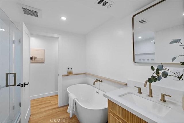 21659 Ocean Vista Dr Unit 20, Laguna Beach, CA 92651 - full bath with a shower stall, a freestanding bath, vanity, wood finished floors, and recessed lighting