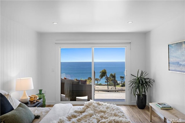 21659 Ocean Vista Dr Unit 20, Laguna Beach, CA 92651 - bedroom with access to outside, wood finished floors, a water view, and recessed lighting