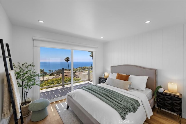 21659 Ocean Vista Dr Unit 20, Laguna Beach, CA 92651 - bedroom with wood finished floors, access to exterior, recessed lighting, and a water view