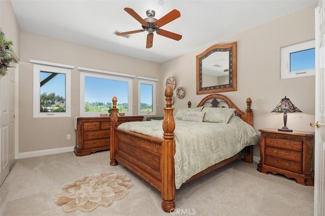 2841 Dos Lomas Pl, Fallbrook, CA 92028 - bedroom with multiple windows, light carpet, and a ceiling fan
