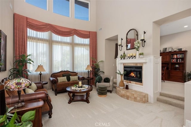 2841 Dos Lomas Pl, Fallbrook, CA 92028 - carpeted living area featuring a tiled fireplace and a high ceiling