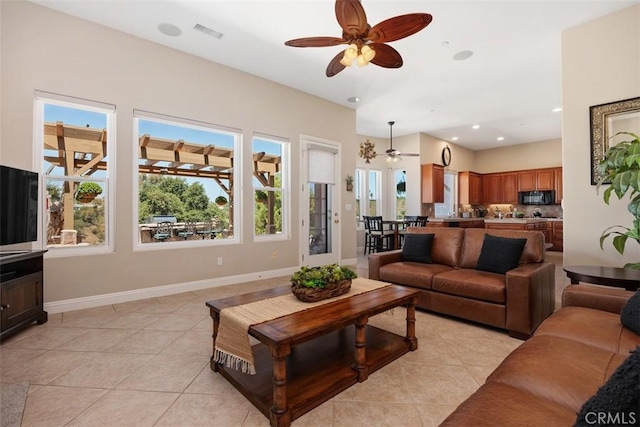 2841 Dos Lomas Pl, Fallbrook, CA 92028 - living area with a ceiling fan, light tile patterned flooring, and recessed lighting