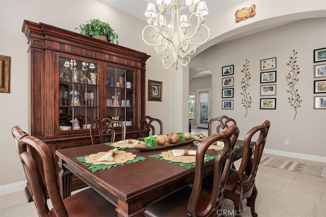 2841 Dos Lomas Pl, Fallbrook, CA 92028 - dining space featuring arched walkways, a chandelier, and light tile patterned floors
