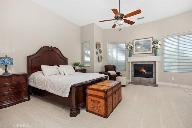 2841 Dos Lomas Pl, Fallbrook, CA 92028 - bedroom featuring light colored carpet, a tiled fireplace, and a ceiling fan