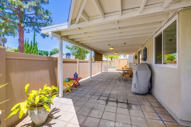 13418 Palm Pl, Cerritos, CA 90703 - fenced backyard with a patio, outdoor dining space, and area for grilling