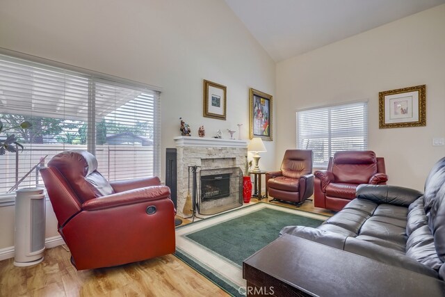 13418 Palm Pl, Cerritos, CA 90703 - living room with a fireplace, wood finished floors, and high vaulted ceiling