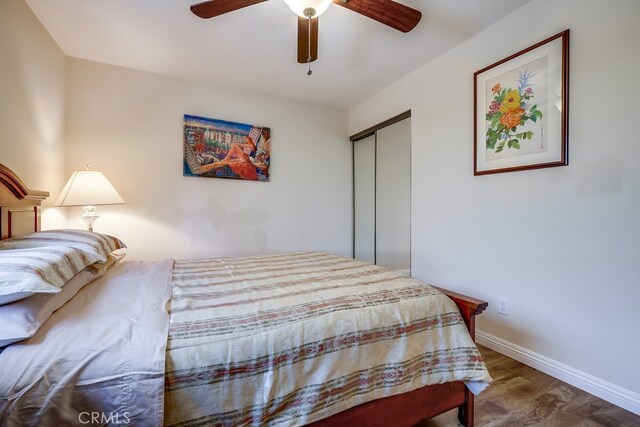 13418 Palm Pl, Cerritos, CA 90703 - bedroom with wood finished floors, a closet, and a ceiling fan