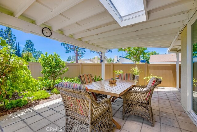 13418 Palm Pl, Cerritos, CA 90703 - fenced backyard featuring outdoor dining space and a patio area