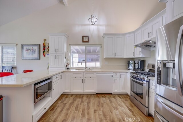 13418 Palm Pl, Cerritos, CA 90703 - kitchen with stainless steel appliances, high vaulted ceiling, a peninsula, light countertops, and white cabinetry