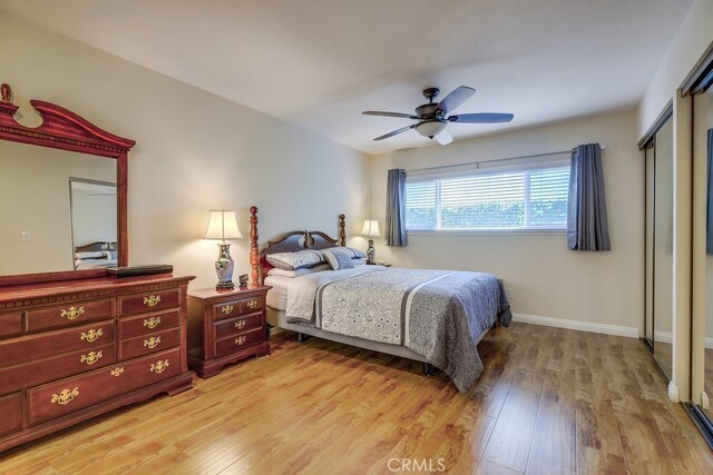 13418 Palm Pl, Cerritos, CA 90703 - bedroom with light wood-style floors, ceiling fan, and a closet