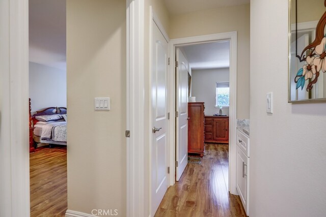 13418 Palm Pl, Cerritos, CA 90703 - hallway featuring wood finished floors