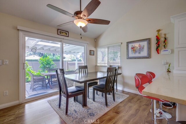 13418 Palm Pl, Cerritos, CA 90703 - dining space with ceiling fan, wood finished floors, and lofted ceiling