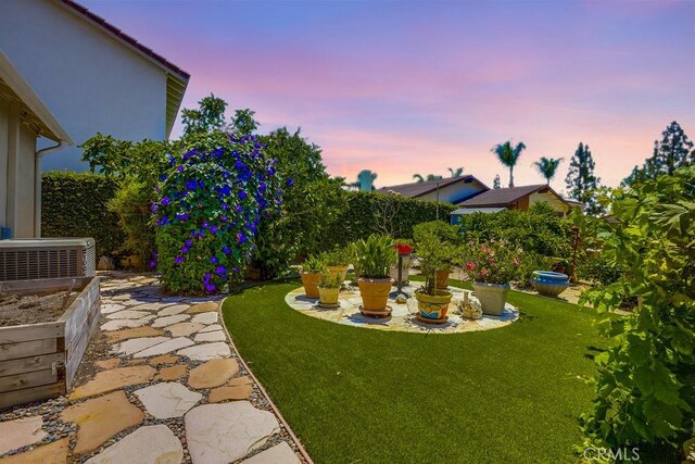 13418 Palm Pl, Cerritos, CA 90703 - yard at dusk featuring a yard
