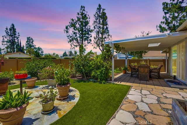 13418 Palm Pl, Cerritos, CA 90703 - fenced backyard with a patio and outdoor dining space