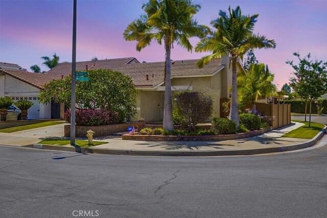 13418 Palm Pl, Cerritos, CA 90703 - view of front of house with stucco siding and concrete driveway