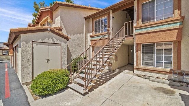 1365 Crafton Ave Unit 1004, Mentone, CA 92359 - property entrance featuring stucco siding and a patio