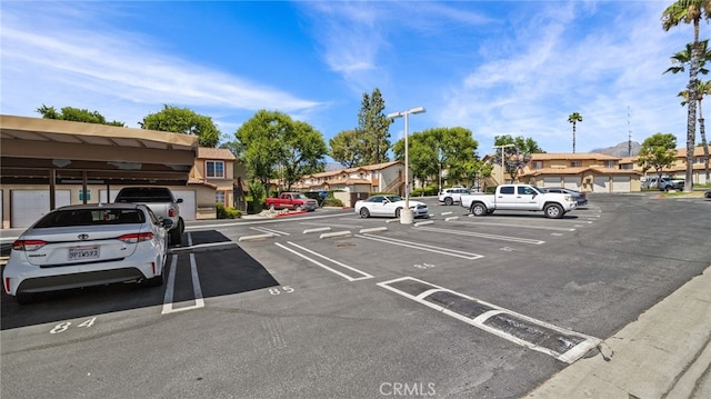 1365 Crafton Ave Unit 1004, Mentone, CA 92359 - uncovered parking lot featuring a residential view