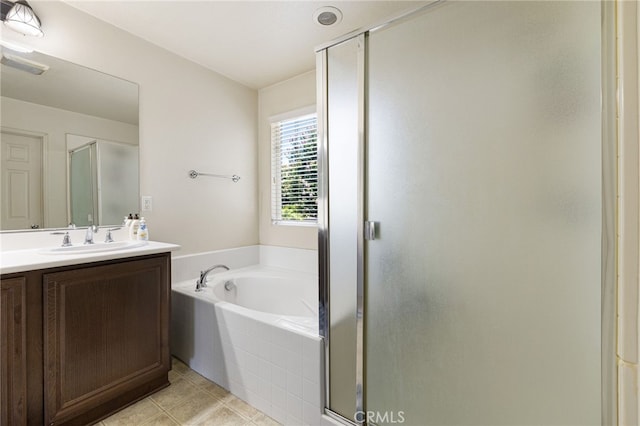 544 W Elm Park Ave, Rialto, CA 92376 - full bath featuring a stall shower, vanity, a garden tub, and tile patterned floors