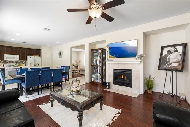 544 W Elm Park Ave, Rialto, CA 92376 - living area featuring ceiling fan, wood finished floors, a tiled fireplace, and recessed lighting