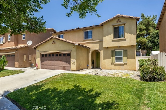 544 W Elm Park Ave, Rialto, CA 92376 - mediterranean / spanish-style home with stucco siding, concrete driveway, a garage, and a tile roof