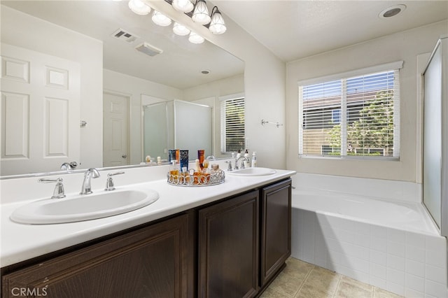 544 W Elm Park Ave, Rialto, CA 92376 - bathroom with double vanity, a shower stall, a garden tub, and tile patterned flooring