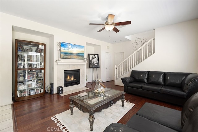 544 W Elm Park Ave, Rialto, CA 92376 - living area featuring stairway, a fireplace, a ceiling fan, and wood finished floors