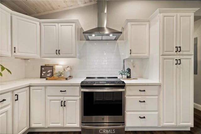 15320 Forest Ranch Way, Forest Ranch, CA 95942 - kitchen with stainless steel electric range oven, wall chimney exhaust hood, white cabinetry, backsplash, and wooden ceiling