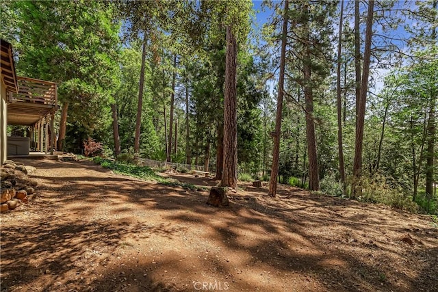 15320 Forest Ranch Way, Forest Ranch, CA 95942 - view of yard featuring a wooden deck and a wooded view
