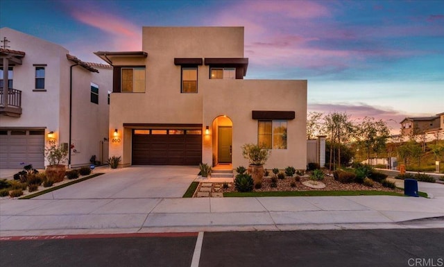 660 Westbrook Loop, San Marcos, CA 92078 - view of front of house featuring driveway, stucco siding, and a garage