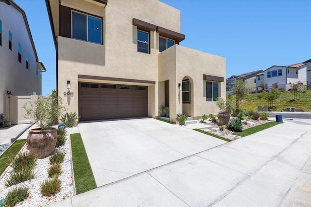 660 Westbrook Loop, San Marcos, CA 92078 - view of front of home with stucco siding, an attached garage, concrete driveway, and a residential view