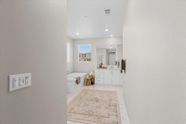 660 Westbrook Loop, San Marcos, CA 92078 - bathroom featuring a textured wall, vanity, a tub, and recessed lighting