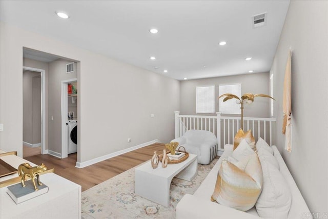 660 Westbrook Loop, San Marcos, CA 92078 - living room featuring washer / dryer, wood finished floors, and recessed lighting