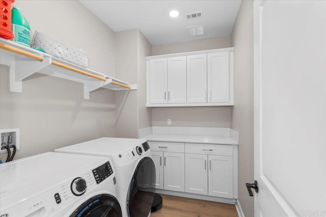 660 Westbrook Loop, San Marcos, CA 92078 - washroom with washer and dryer, cabinet space, light wood-style flooring, and recessed lighting