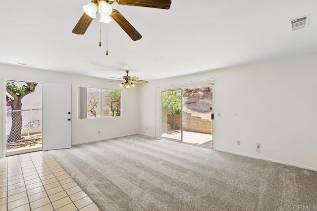 2239 Sunset Dr, Escondido, CA 92025 - empty room featuring ceiling fan, light carpet, and light tile patterned floors