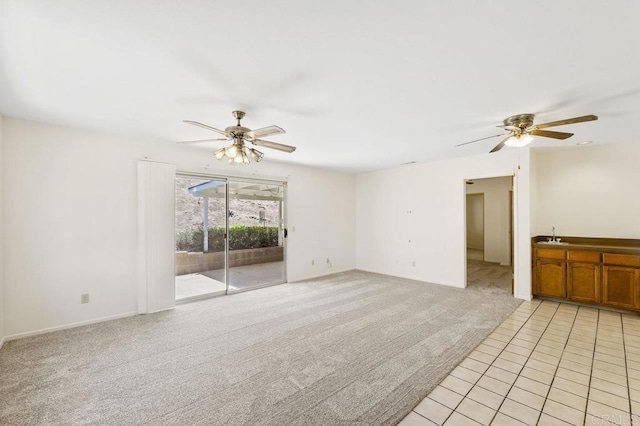 2239 Sunset Dr, Escondido, CA 92025 - unfurnished living room with a ceiling fan, light colored carpet, and light tile patterned floors