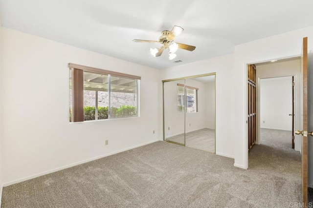 2239 Sunset Dr, Escondido, CA 92025 - unfurnished bedroom with carpet, a closet, and a ceiling fan