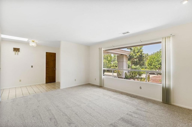 2239 Sunset Dr, Escondido, CA 92025 - unfurnished room with light carpet and light tile patterned floors