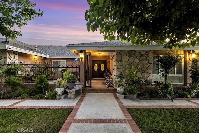 7951 Woodlake Ave, West Hills, CA 91304 - entrance to property featuring stone siding