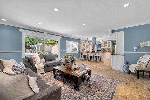 7951 Woodlake Ave, West Hills, CA 91304 - living room featuring crown molding, plenty of natural light, recessed lighting, and light stone finish floors