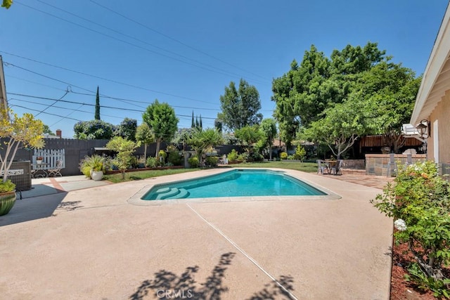 7951 Woodlake Ave, West Hills, CA 91304 - view of swimming pool with a patio and a fenced backyard