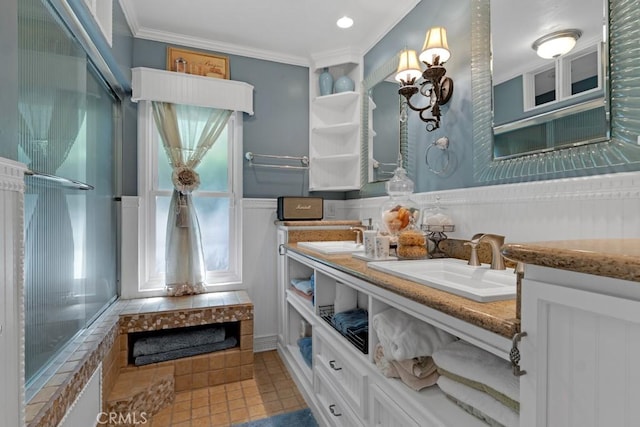 7951 Woodlake Ave, West Hills, CA 91304 - full bathroom featuring double vanity, crown molding, tile patterned flooring, and a wainscoted wall