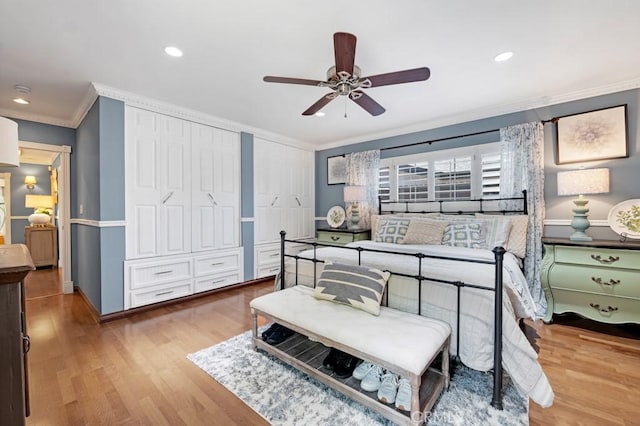 7951 Woodlake Ave, West Hills, CA 91304 - bedroom featuring crown molding, wood finished floors, two closets, recessed lighting, and ceiling fan