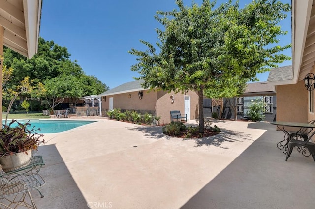 7951 Woodlake Ave, West Hills, CA 91304 - view of swimming pool with a patio