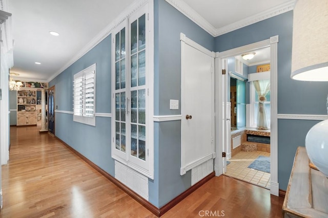 7951 Woodlake Ave, West Hills, CA 91304 - hallway featuring crown molding and wood finished floors