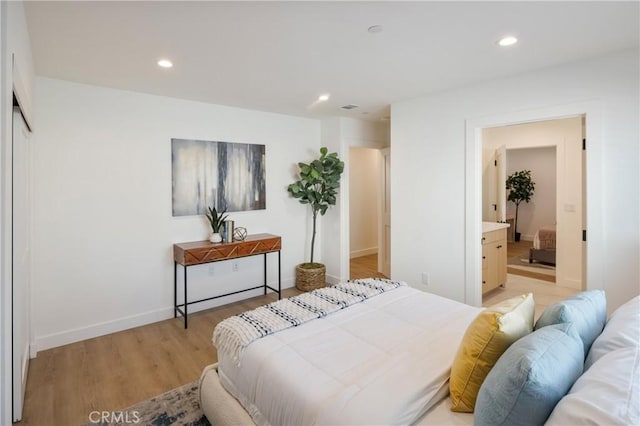20109 Archwood St, Winnetka, CA 91306 - bedroom with light wood-type flooring, recessed lighting, and ensuite bath