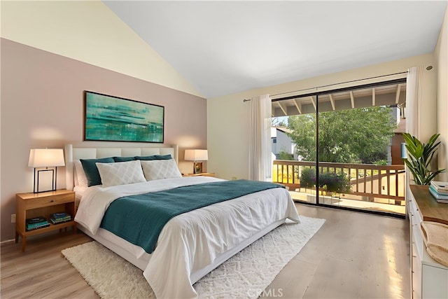 21730 Marylee St Unit 29, Woodland Hills, CA 91367 - bedroom with access to exterior, lofted ceiling, and wood finished floors