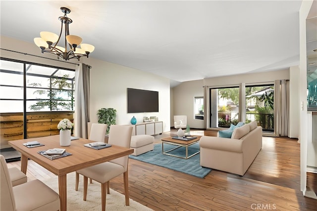 21730 Marylee St Unit 29, Woodland Hills, CA 91367 - living room featuring a chandelier, hardwood / wood-style flooring, and lofted ceiling